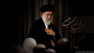 Ali Khamenei in formal black attire with white beard and glasses HD wallpaper