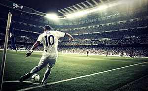 Mesut Ozil in White Kit Taking a Corner Kick at a Packed Night Stadium HD wallpaper