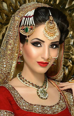Elegant Indian Bridal Portrait With Traditional Gold Jewelry And Red Lehenga HD phone wallpaper