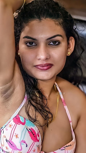 Reshmi Nair in a Pink Flamingo Bikini Top with Gold Jewelry HD phone wallpaper