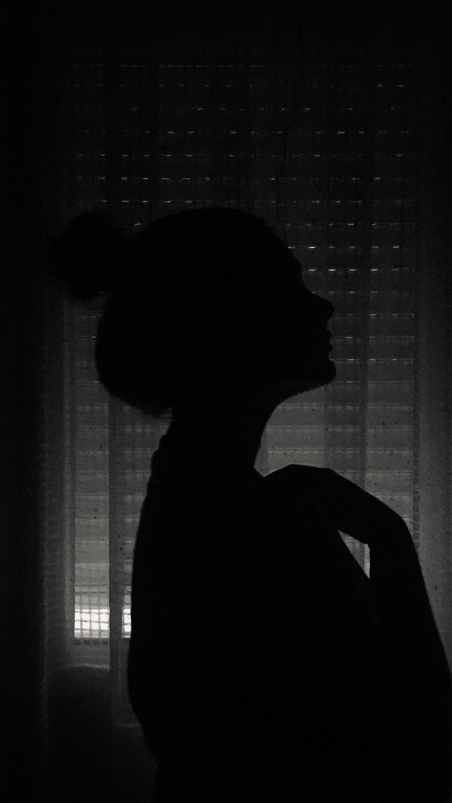 Moody Black and White Silhouette of a Woman in Profile Against a Window HD phone wallpaper