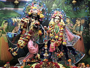 Radha Krishna ISKCON Temple Deities Adorned in Vibrant Floral Garlands and Traditional Attire HD wallpaper
