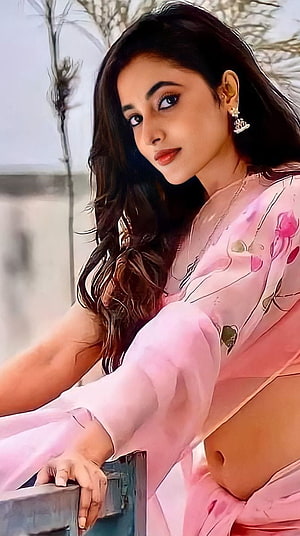 Priyanka Mohan in a Pink Floral Saree with Long Wavy Hair and Elegant Jewelry HD phone wallpaper