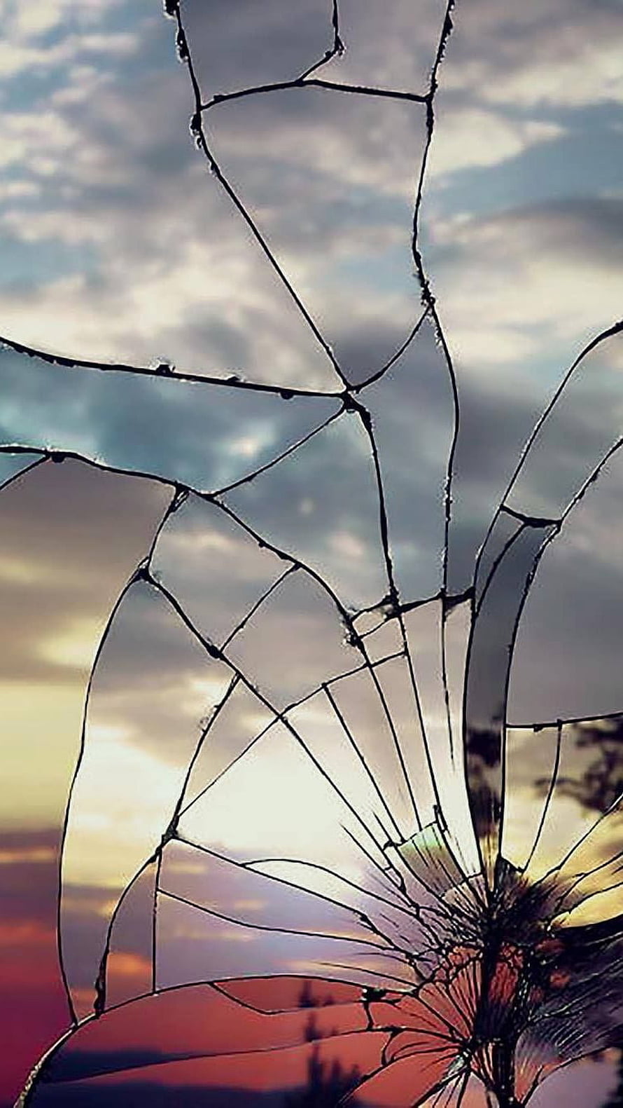 Shattered Glass Cracks Against a Dramatic Sunset Sky HD phone wallpaper
