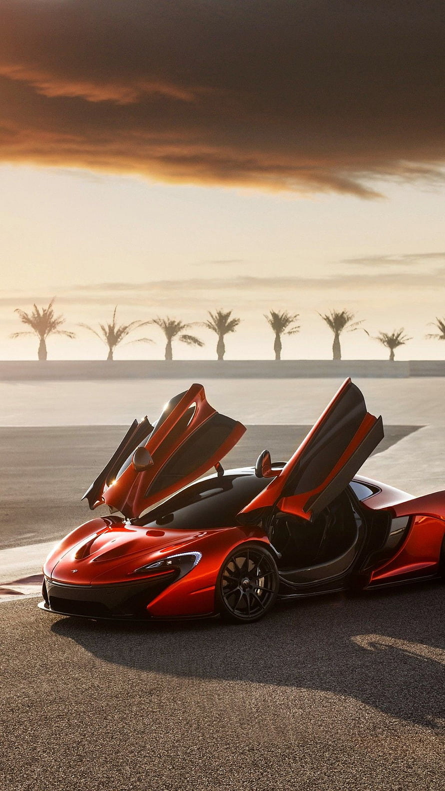 Red McLaren P1 Hypercar with Butterfly Doors Open at Sunset HD phone wallpaper