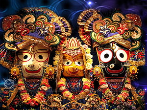 Jagannath Deity with Balabhadra and Subhadra in Ornate Temple Attire HD wallpaper