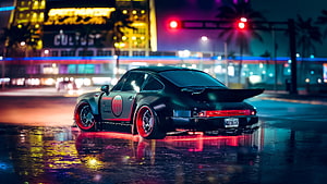 Black Porsche 911 with red rims parked on wet asphalt in a neon-lit city street at night HD wallpaper
