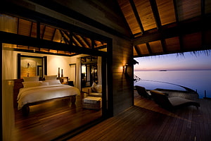 Luxury Overwater Villa Bedroom with Ocean View at Dusk HD wallpaper