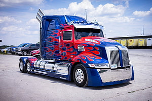 Custom Painted Western Star Semi Truck With Red And Blue Flame Design HD wallpaper
