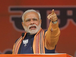 Narendra Modi Pointing Upward at a Political Rally with BJP Lotus Badge HD wallpaper