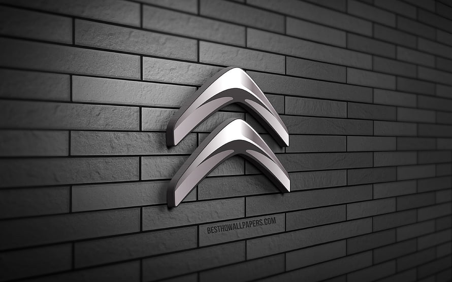 Citroën 3D chrome logo mounted on a dark gray brick wall with dramatic lighting HD wallpaper