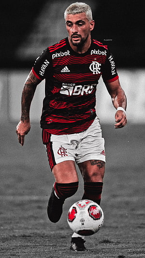 Arrascaeta in Flamengo Kit Dribbling the Ball on the Pitch HD phone wallpaper