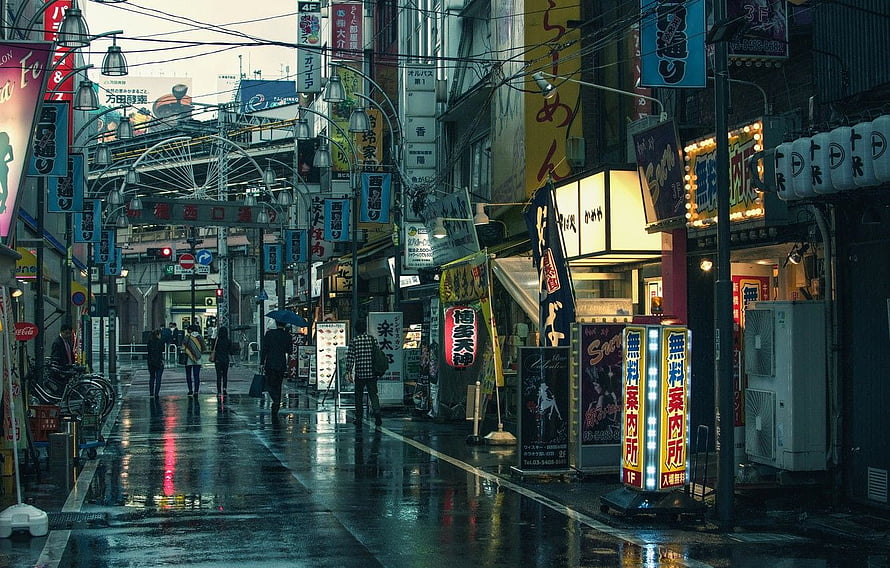 Rainy Tokyo Street Scene with Neon Signs and Wet Pavement Reflections HD wallpaper