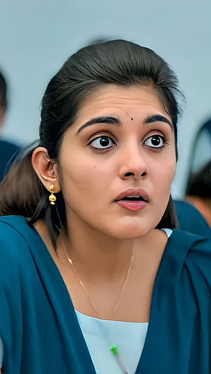 Nivetha Thomas Portrait in Teal Blazer with Gold Earrings HD phone wallpaper