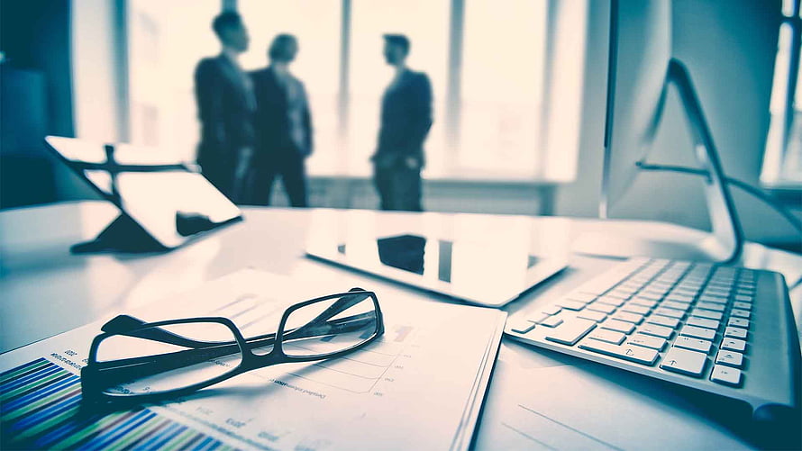 Modern Office Desk With Glasses, Financial Reports, And Laptop In Corporate Setting HD wallpaper