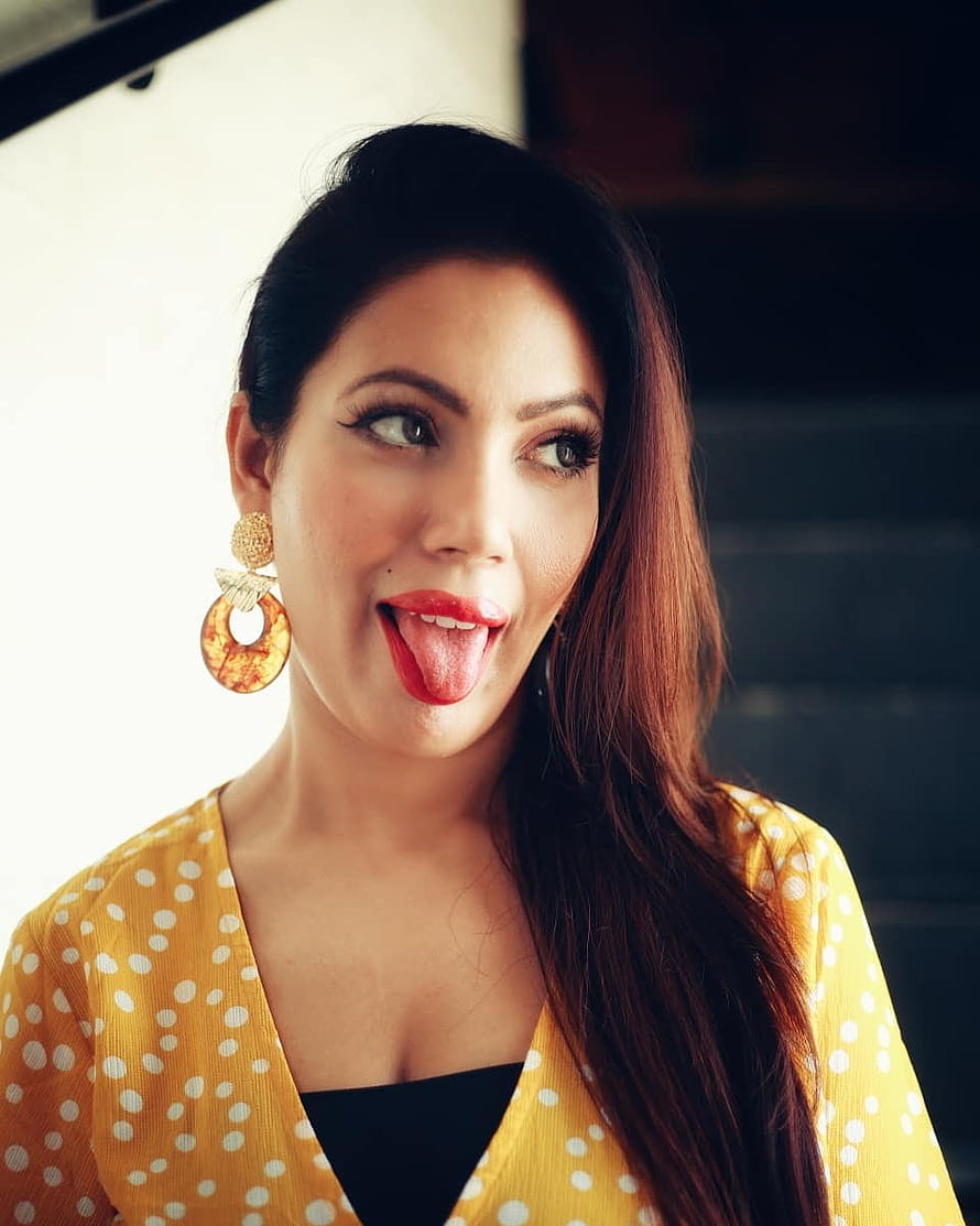 Munmun Dutta Playful Portrait in Yellow Polka Dot Top with Statement Earrings HD phone wallpaper