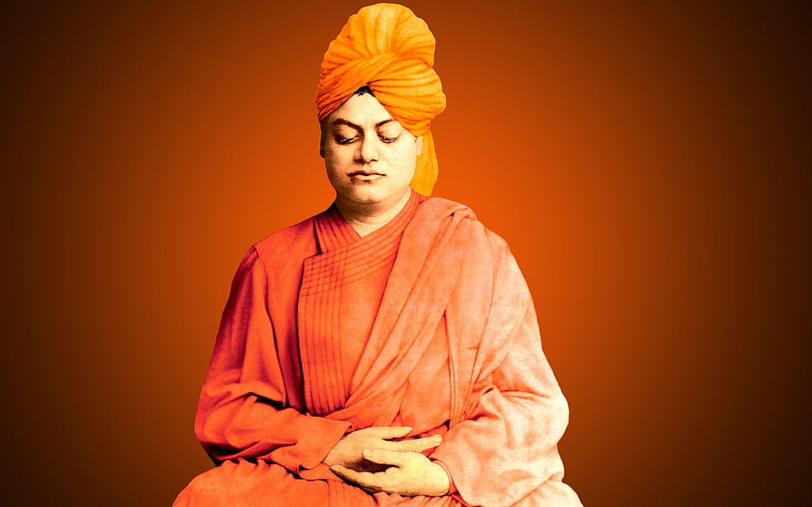 Swami Vivekananda in traditional orange robes and turban with eyes closed in meditation HD wallpaper