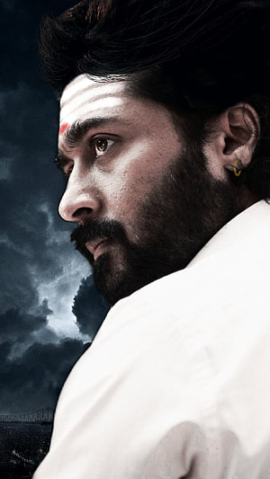 Suriya Dramatic Profile Portrait Against Stormy Sky HD phone wallpaper
