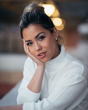 Alina Lopez Portrait in White Turtleneck Sweater with Soft Bokeh Background HD phone wallpaper