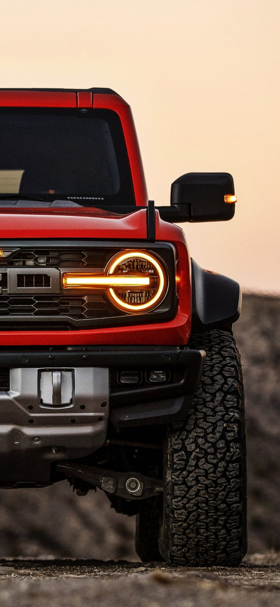 Red Ford Bronco Raptor Front Grille and Headlight Close-Up at Sunset HD phone wallpaper