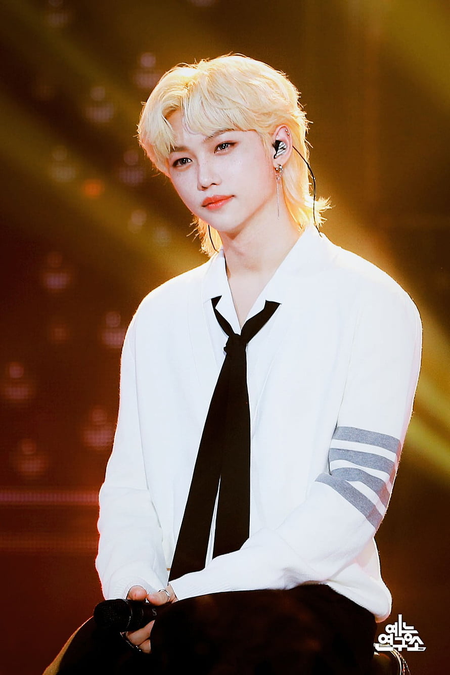 Felix from Stray Kids on stage in a white shirt and black tie with platinum blonde hair HD phone wallpaper