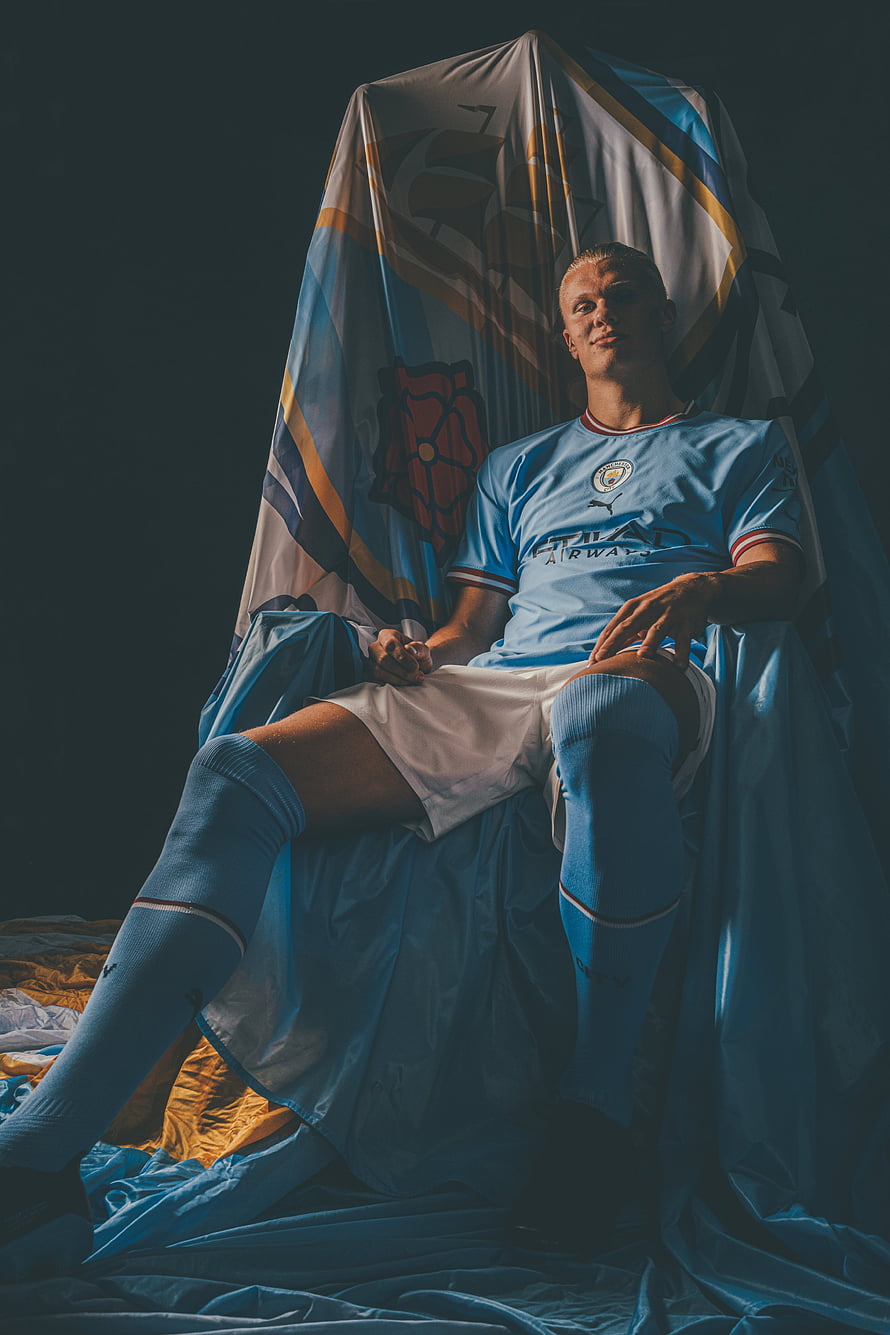 Erling Haaland in Manchester City Kit Seated on Throne with Draped Fabric HD phone wallpaper