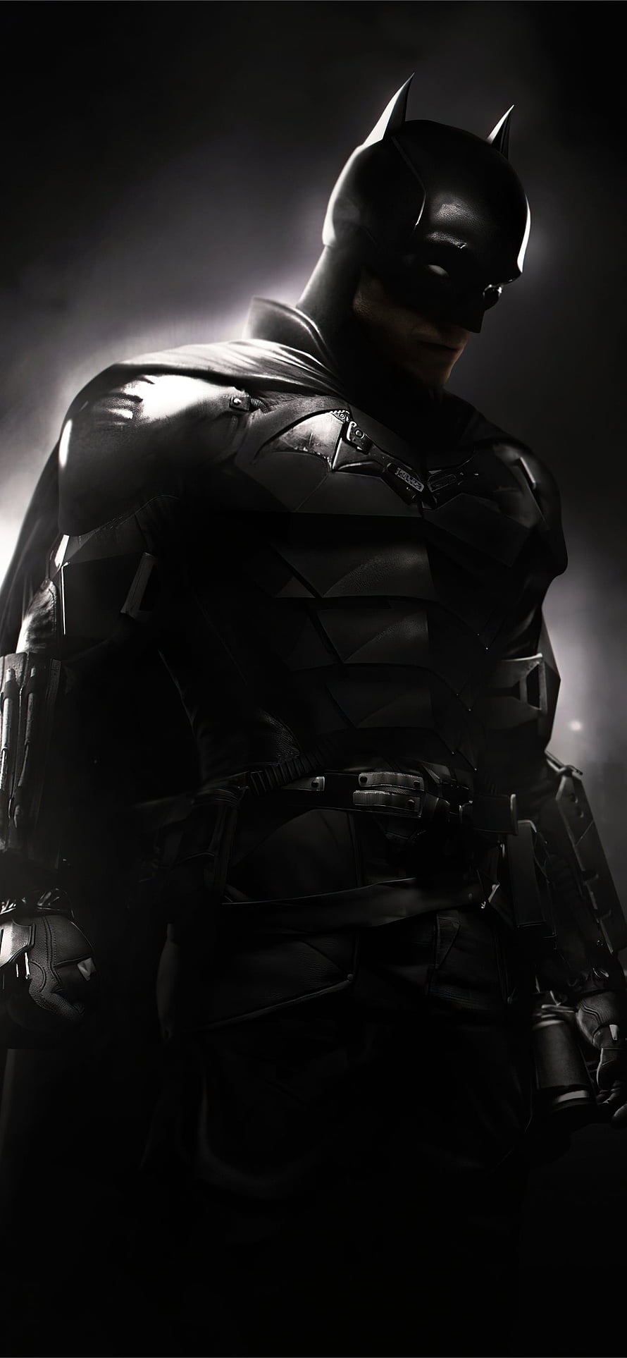 Robert Pattinson as Batman in Dark Tactical Suit with Dramatic Backlighting HD phone wallpaper