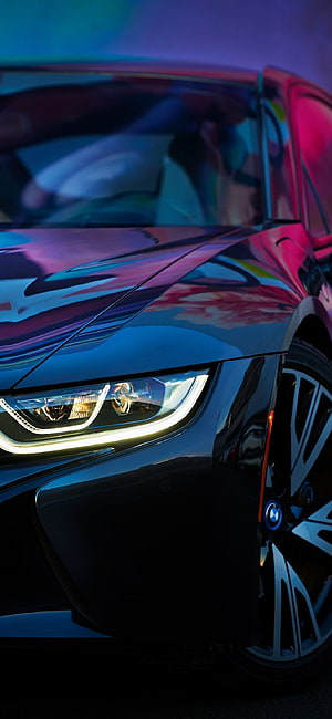 BMW i8 Front Headlight Close-Up with Neon Blue and Pink Reflections HD phone wallpaper