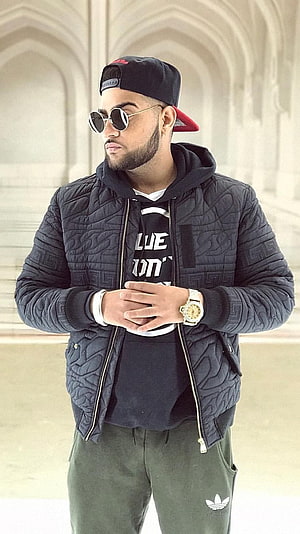 Karan Aujla in Black Quilted Jacket and Adidas Track Pants HD phone wallpaper