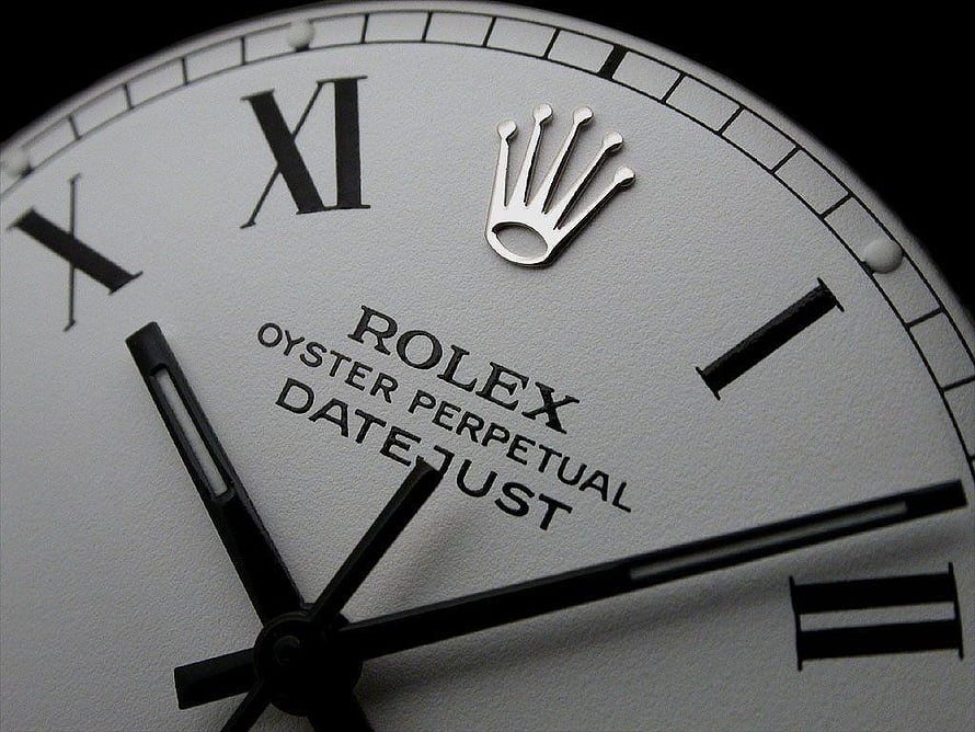 Close-Up of a Rolex Oyster Perpetual Datejust Watch Face with Roman Numerals and Crown Logo HD wallpaper