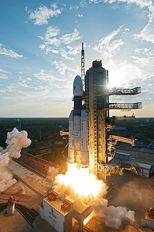 ISRO GSLV Mk III rocket launch with bright engine flames and smoke at the launch pad HD phone wallpaper