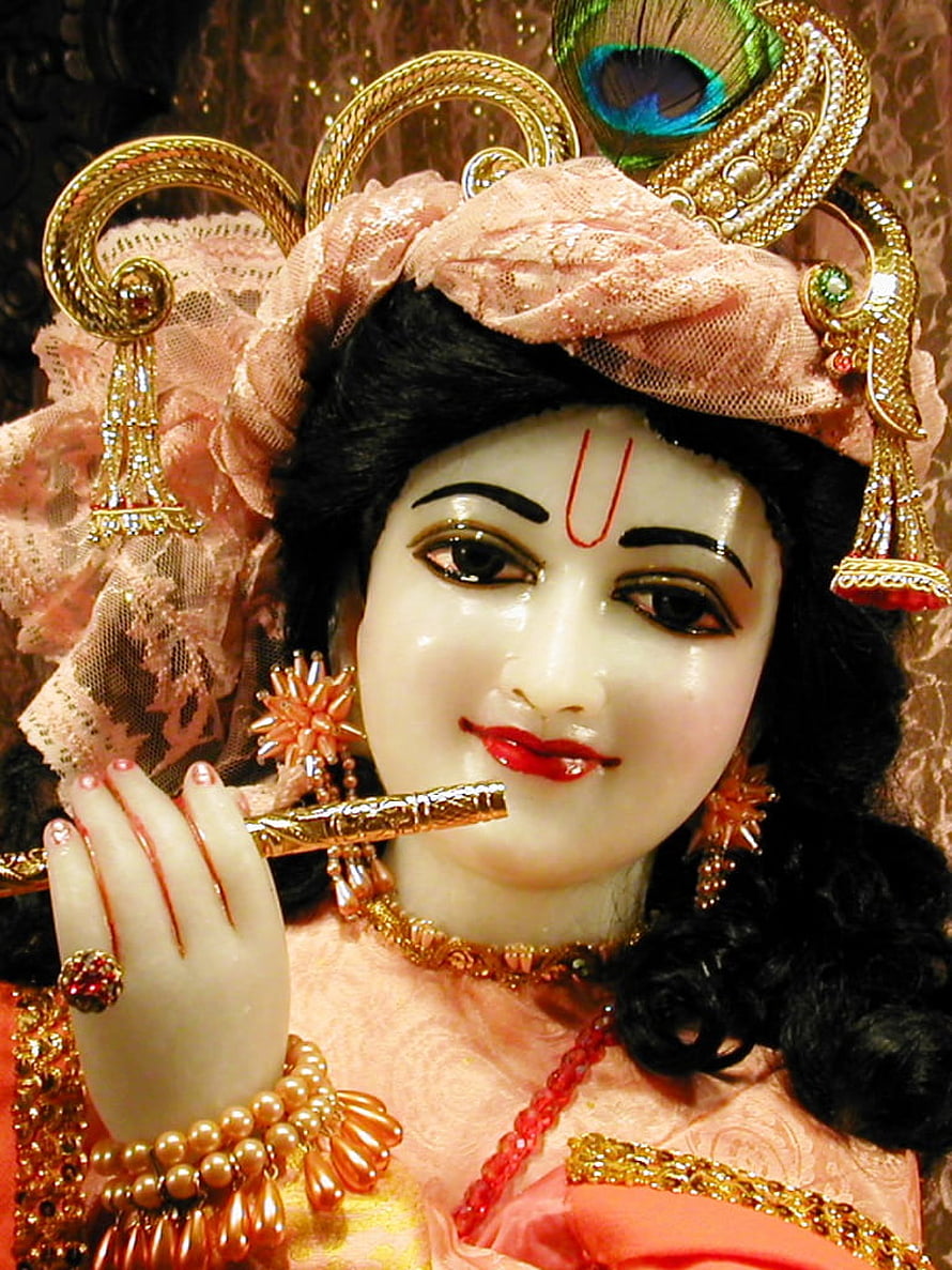 Ornate Krishna Idol with Flute and Peacock Feather Crown HD phone wallpaper