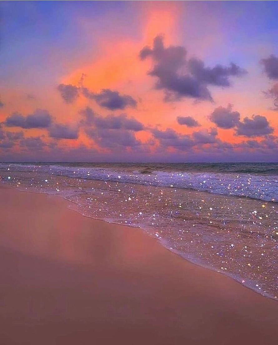 Vibrant Sunset Beach with Sparkling Water and Dramatic Clouds HD phone wallpaper