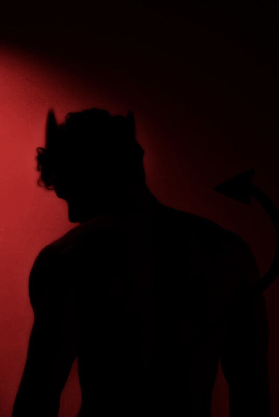 Devil Silhouette Portrait Against Deep Red Backdrop HD phone wallpaper