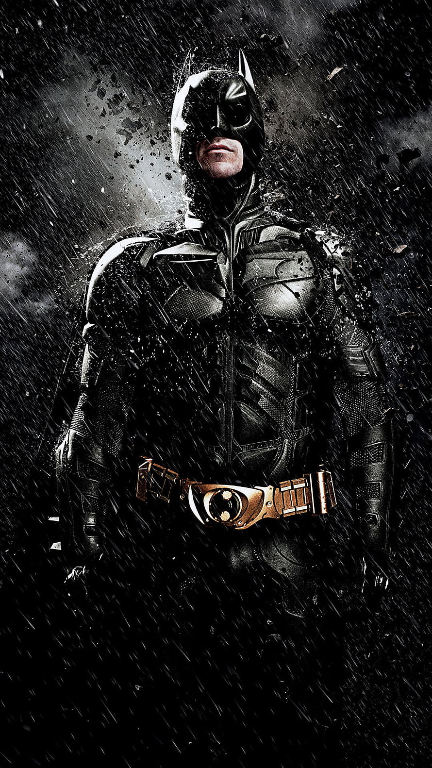 Batman in Dark Knight Rises Suit Standing in Heavy Rain with Dramatic Lighting HD phone wallpaper