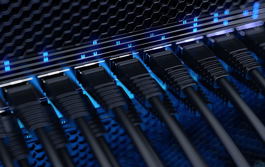 Close-up of network switch ports with glowing blue LED indicators and connected ethernet cables HD wallpaper