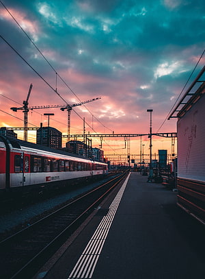 SBB CFF FFS Train at a City Railway Station Under a Dramatic Sunset Sky HD phone wallpaper