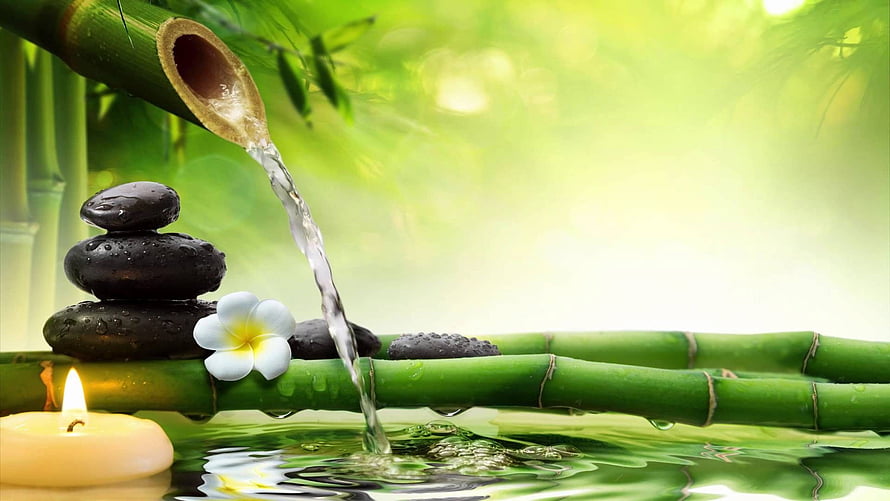 Tranquil Spa Scene With Bamboo Water Feature, Stacked Stones, Plumeria Flower, and Candlelight HD wallpaper