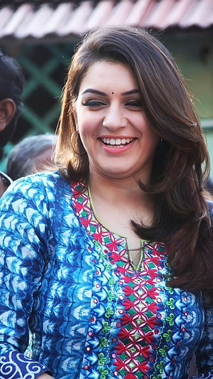 Hansika Motwani smiling in a vibrant blue embroidered kurta with floral details HD phone wallpaper