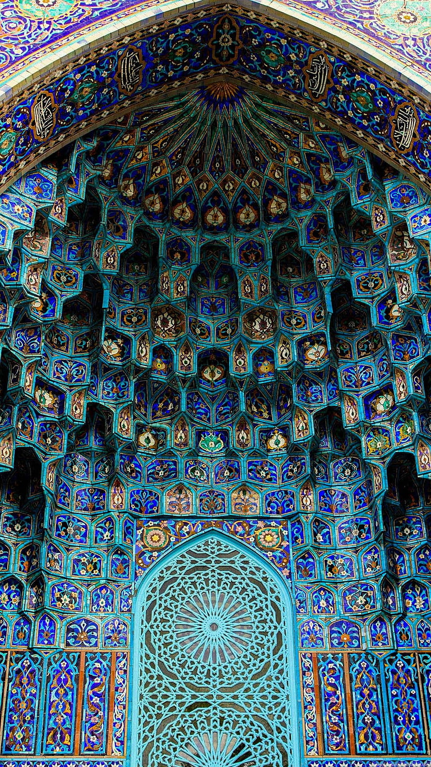 Intricate Blue Tilework and Muqarnas Vaulting in Islamic Architecture HD phone wallpaper