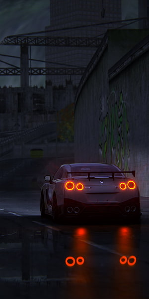 Nissan GT-R R35 Rear View on Wet Urban Street at Night with Glowing Taillights HD phone wallpaper