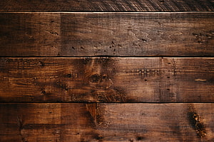 Rustic Dark Wood Plank Texture with Natural Grain and Knots HD wallpaper