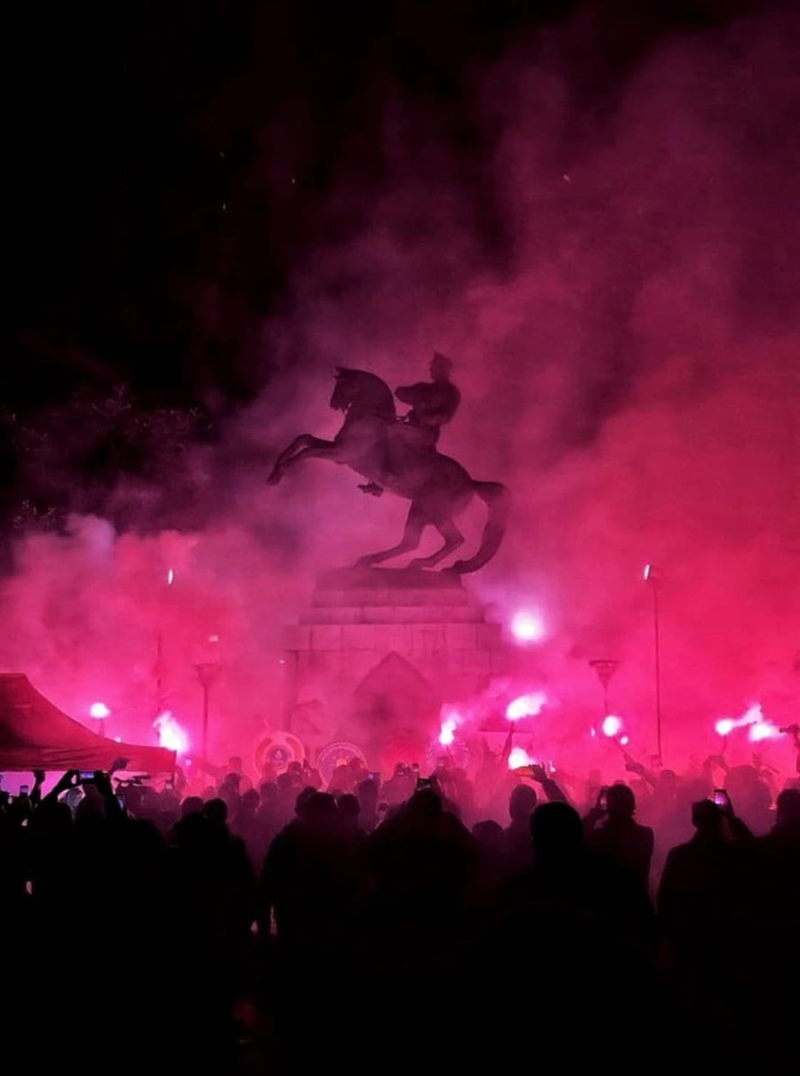 Ataturk Equestrian Statue Silhouetted in Pink Smoke at Nighttime Crowd Gathering HD phone wallpaper