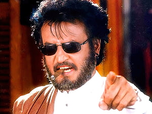 Rajinikanth as Padayappa in a White Shirt with Sunglasses and Cigar HD wallpaper
