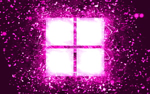 Glowing Windows 11 Logo in Vibrant Purple Neon Particle Explosion HD wallpaper
