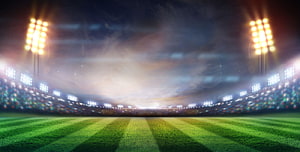 Illuminated Cricket Stadium at Night with Floodlights and Green Pitch HD wallpaper