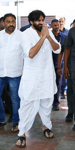 Pawan Kalyan in white kurta and dhoti with hands pressed in namaste greeting HD phone wallpaper