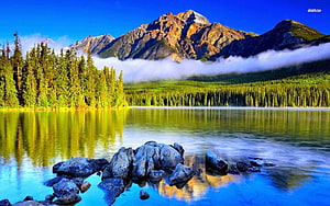 Serene Mountain Lake Landscape With Pine Forest And Rocky Shoreline HD wallpaper