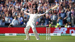 Ben Stokes Celebrating a Cricket Milestone in White Test Kit on the Field HD wallpaper