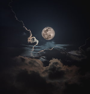Full Moon Rising Above Dramatic Storm Clouds in a Dark Night Sky HD phone wallpaper
